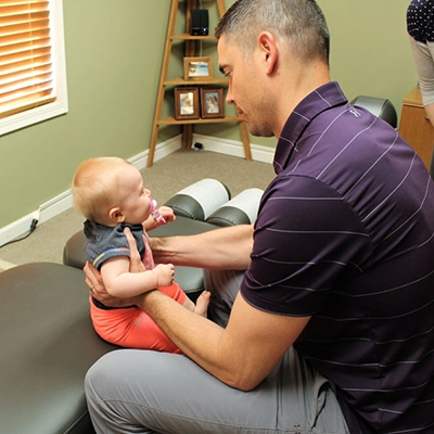 Chiropractor Rochester MN Matt Suntken With Baby