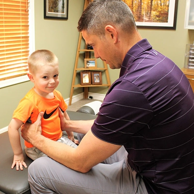 Chiropractor Rochester MN Matt Suntken With Child