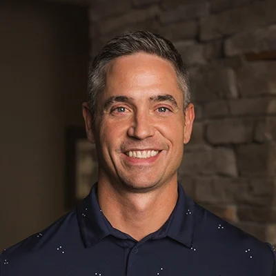 Chiropractor Matt Suntken In Front Of Blurred Wall